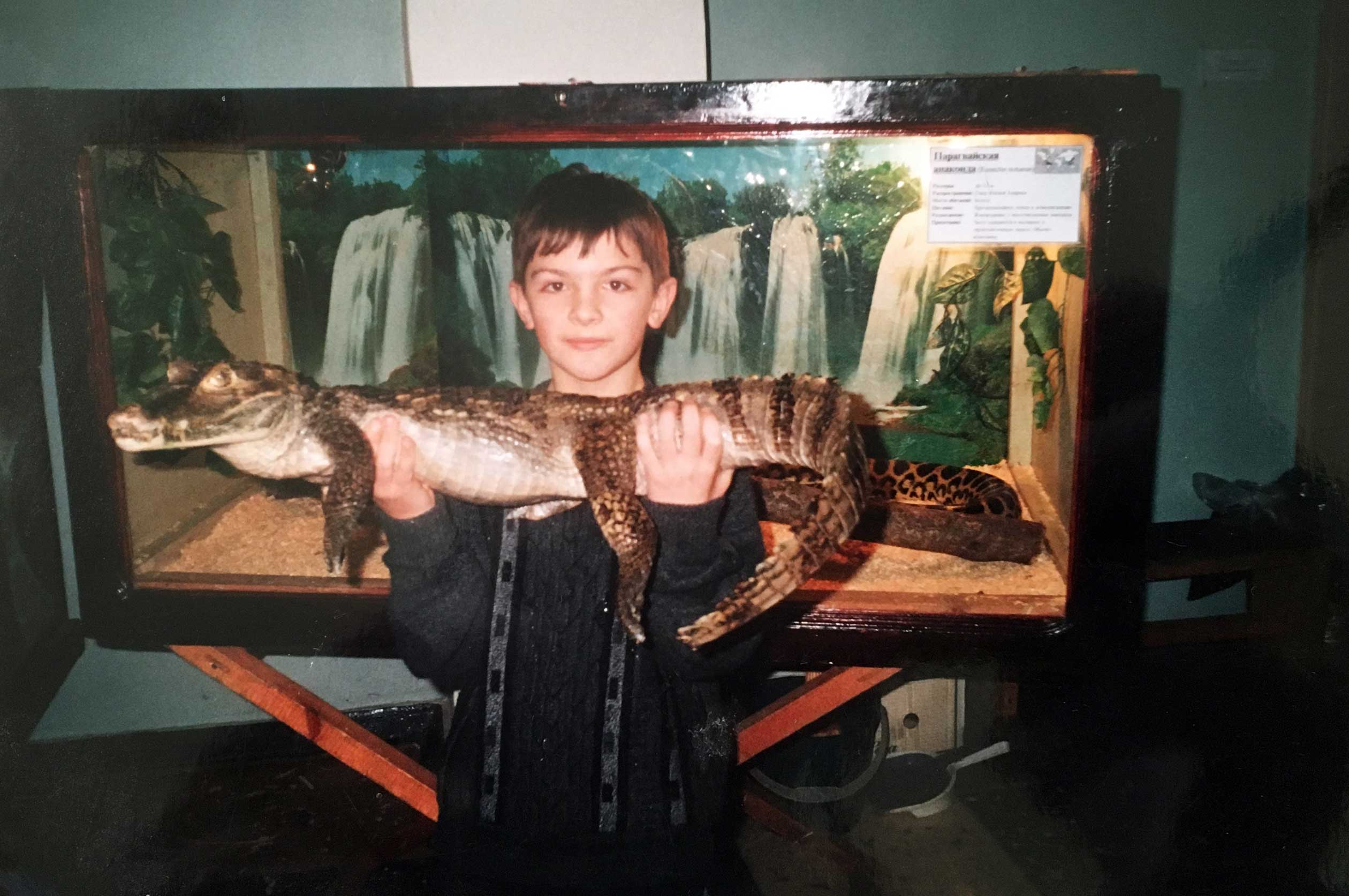 Alexander Fufaev holds crocodile in his hand