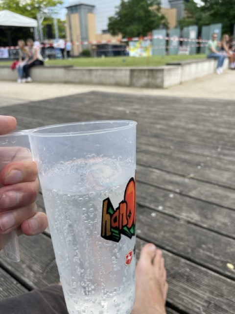 Alexander Fufaev at the summer festival 2024 on campus drinking Sprite